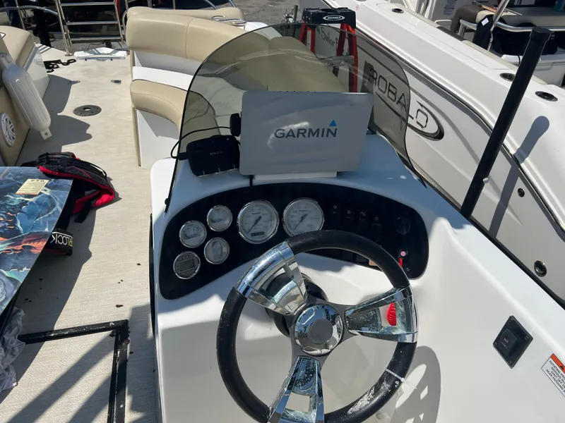 Slide: The Image of Steering console of 2016 Caravelle RAZOR 238PR with Garmin navigation system. - 1