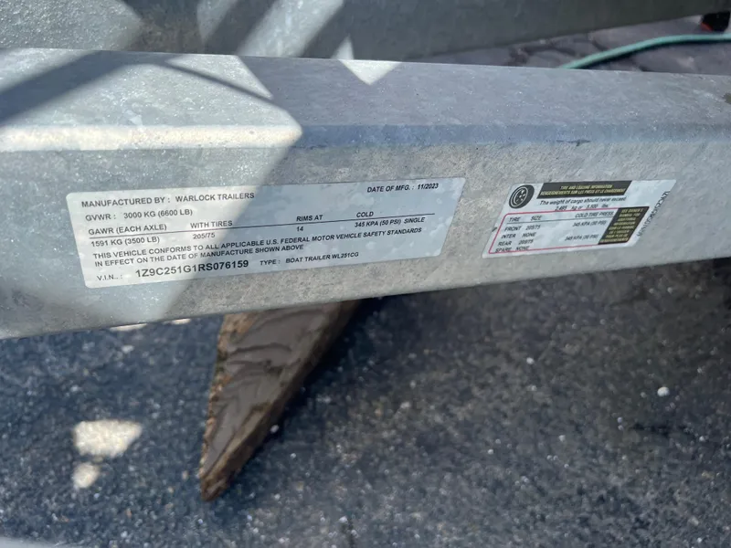 Slide: The Image of Trailer label on a 2016 Caravelle RAZOR 238PR, showing specifications and manufacturing details. - 11