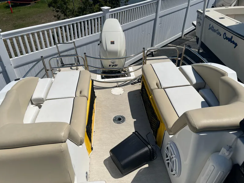 Slide: The Image of 2016 Caravelle RAZOR 238PR boat interior with beige seating and Yamaha outboard motor. - 9