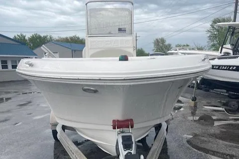Slide: The Image of 2016 Robalo R180 CC boat on trailer, front view, overcast sky. - 2