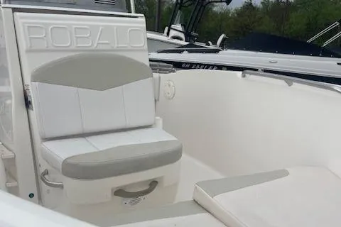 Slide: The Image of 2016 Robalo R180 CC boat interior with cushioned seating and storage. - 4