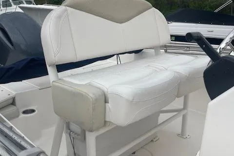 Slide: The Image of White seating on 2016 Robalo R180 CC boat, featuring dual cushioned seats. - 6