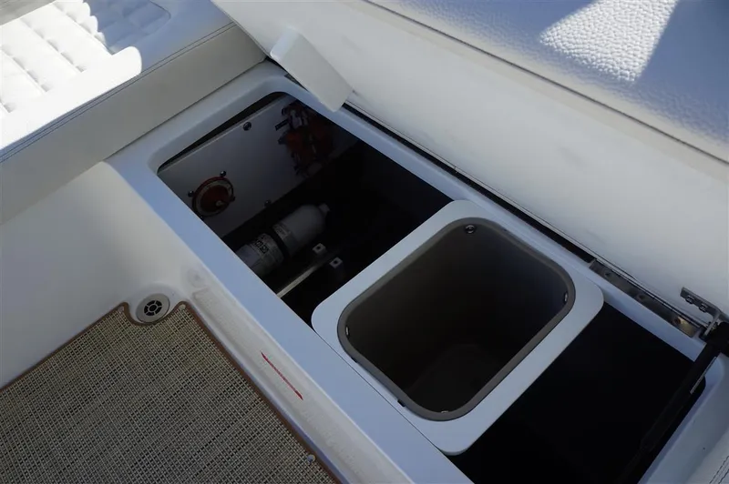 Slide: The Image of Storage compartment in a 2017 Cobalt R7 boat, featuring an open hatch and visible interior. - 10