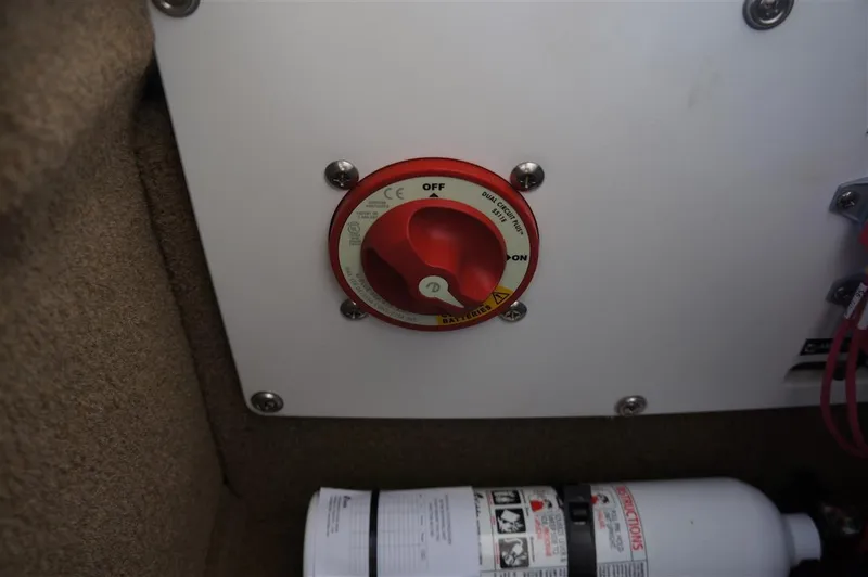 Slide: The Image of Battery switch and fire extinguisher in 2017 Cobalt R7 boat interior. - 11