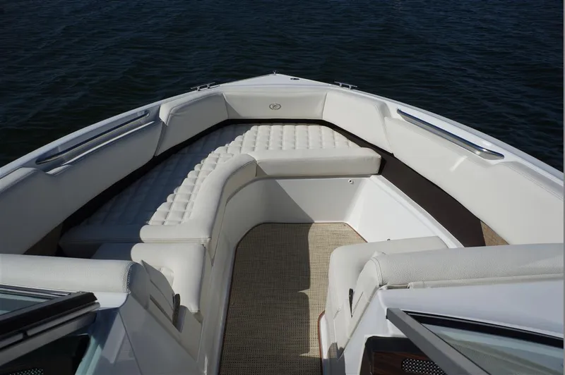 Slide: The Image of 2017 Cobalt R7 boat with spacious white seating on calm water. - 16