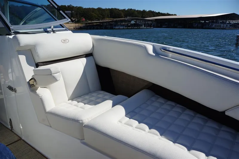 Slide: The Image of Luxurious white seating on a 2017 Cobalt R7 boat by the water. - 18