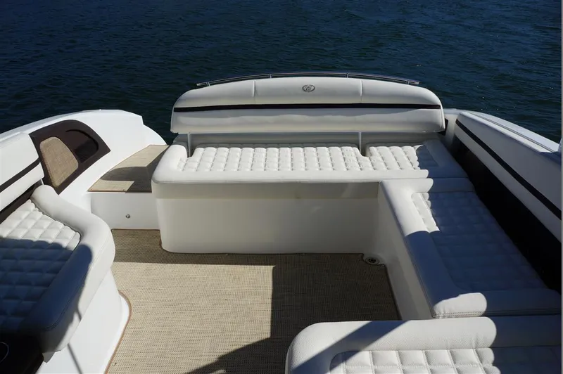 Slide: The Image of Luxurious seating area on a 2017 Cobalt R7 boat, featuring white cushioned seats. - 20