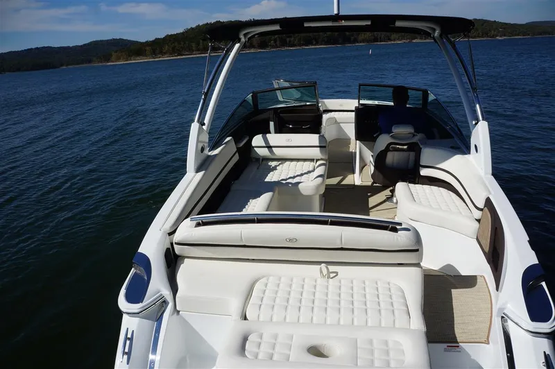 Slide: The Image of 2017 Cobalt R7 boat with spacious seating on a serene lake. - 6