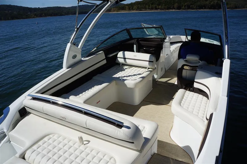 Slide: The Image of 2017 Cobalt R7 boat with luxurious white seating on a calm lake. - 7