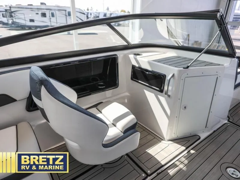 Slide: The Image of 2024 Model 195 S boat interior with seating and dashboard, Bretz RV & Marine. - 11