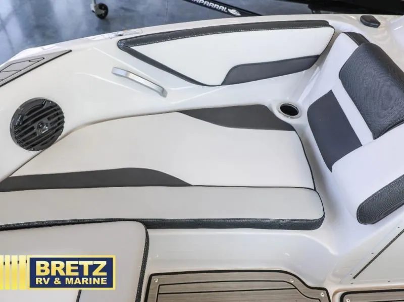 Slide: The Image of 2024 Model 195 S boat interior with sleek white and gray seating, Bretz RV & Marine logo. - 13