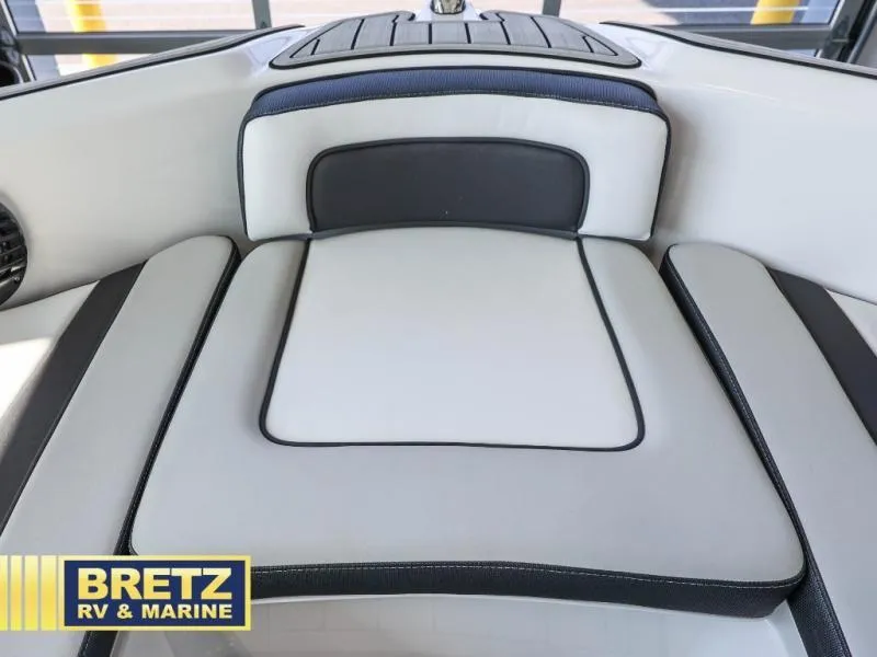 Slide: The Image of 2024 Model 195 S boat interior with cushioned seating, Bretz RV & Marine branding. - 15