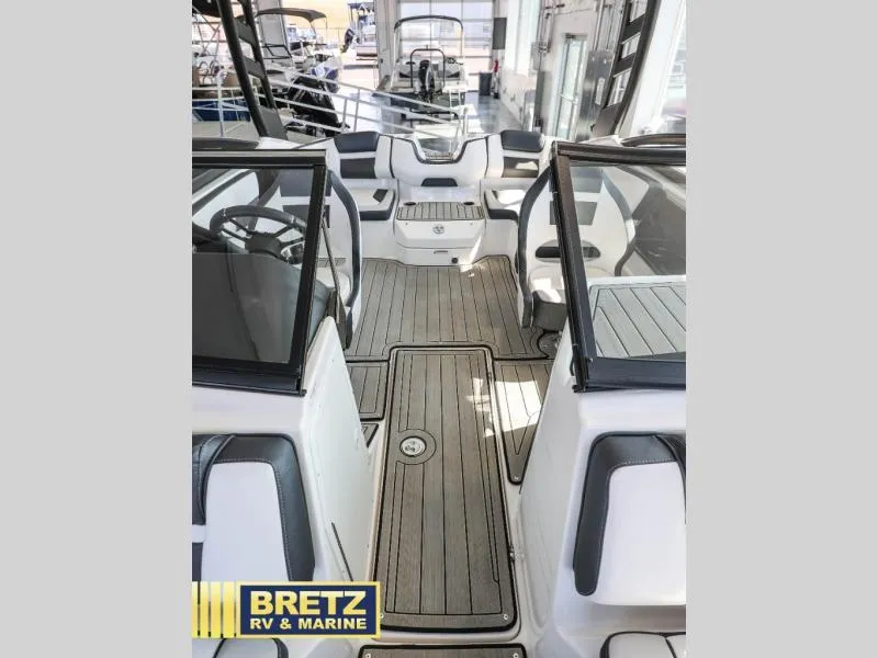 Slide: The Image of 2024 Model 195 S boat interior with sleek seating and modern design. - 16