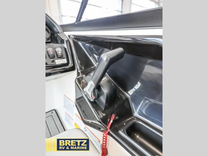 Slide: The Image of 2024 Model 195 S boat throttle control in a marine setting. - 17
