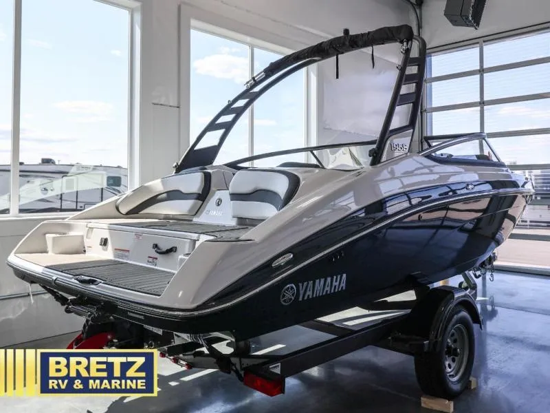 Slide: The Image of 2024 Yamaha 195 S boat in showroom, displayed by Bretz RV & Marine. - 3
