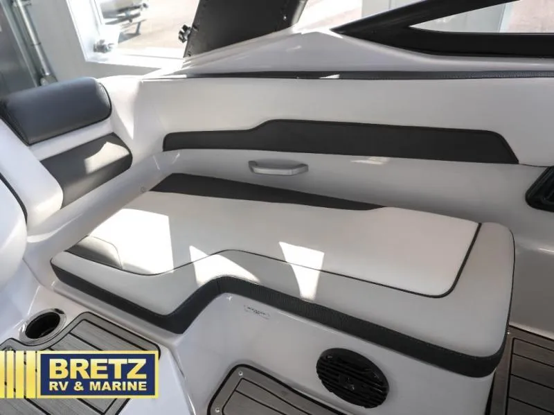 Slide: The Image of 2024 Model 195 S boat interior with sleek seating, Bretz RV & Marine branding. - 8