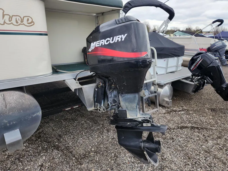 Slide: The Image of 2005 Tahoe Pontoon GRAND TAHOE XRP 23 with Mercury outboard motor on gravel. - 5