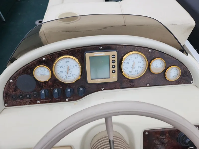 Slide: The Image of Dashboard of 2005 Tahoe Pontoon GRAND TAHOE XRP 23 with gauges and controls. - 9