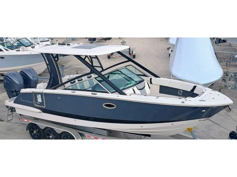 Slide: The Image of 2024 Chaparral 280 OSX boat with sleek design on a trailer. - 0