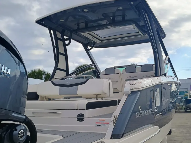 Slide: The Image of 2024 Chaparral 280 OSX boat with Yamaha engine, featuring sleek design and spacious seating. - 6