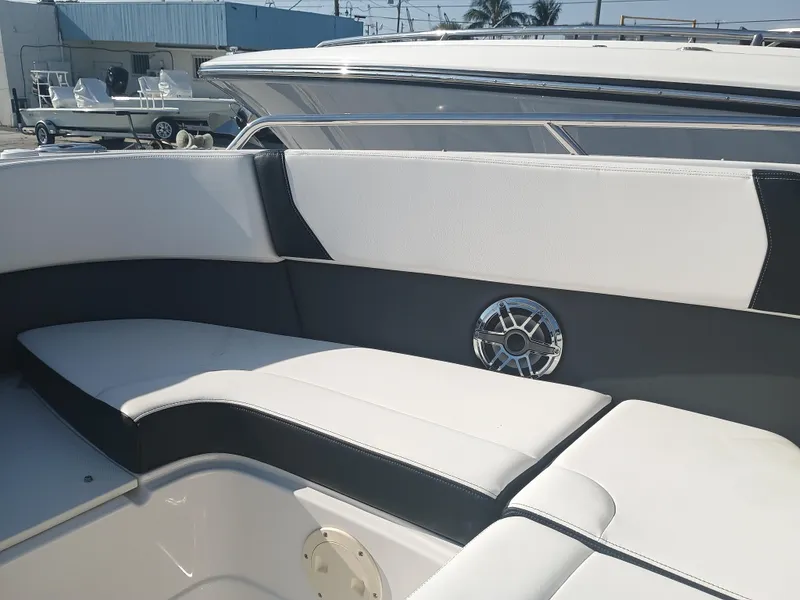Slide: The Image of 2024 Chaparral 280 OSX boat interior with sleek seating and modern design. - 9