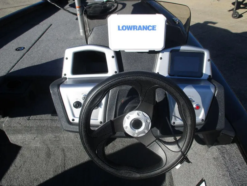 Slide: The Image of 2025 Tracker Pro Team™ 175 TXW boat dashboard with Lowrance electronics and steering wheel. - 4