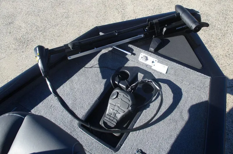 Slide: The Image of 2025 Tracker Pro Team™ 175 TXW boat deck with foot pedal and trolling motor. - 6