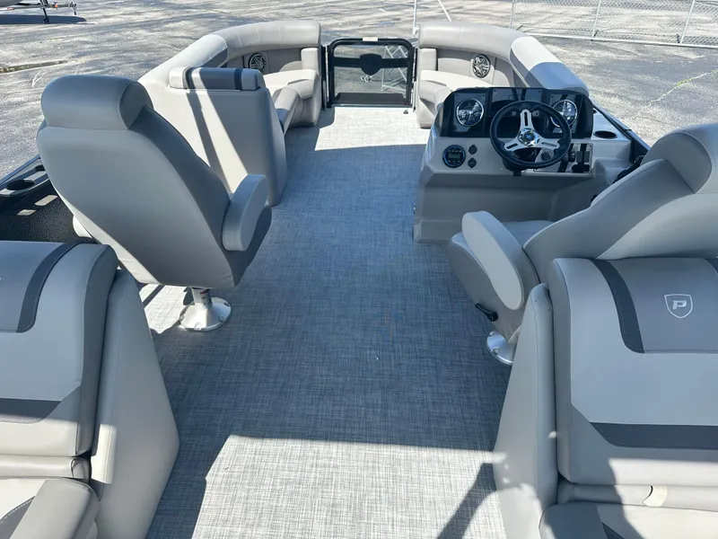 Slide: The Image of 2025 Premier 220 Sunscape RF boat interior with modern seating and steering console. - 12