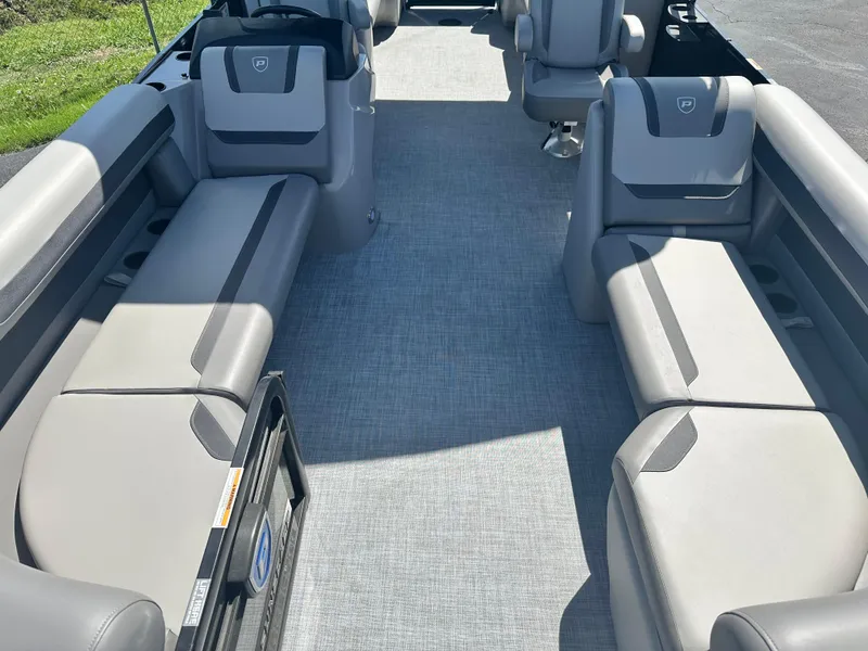 Slide: The Image of 2025 Premier 220 Sunscape RF boat interior with gray seating and carpet flooring. - 8