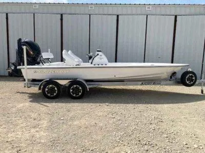 The Image of 2025 Blazer 675 Ultimate Bay boat on trailer, parked outdoors. - 0