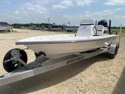 Slide: The Image of 2025 Blazer 675 Ultimate Bay boat on trailer under a clear sky. - 3