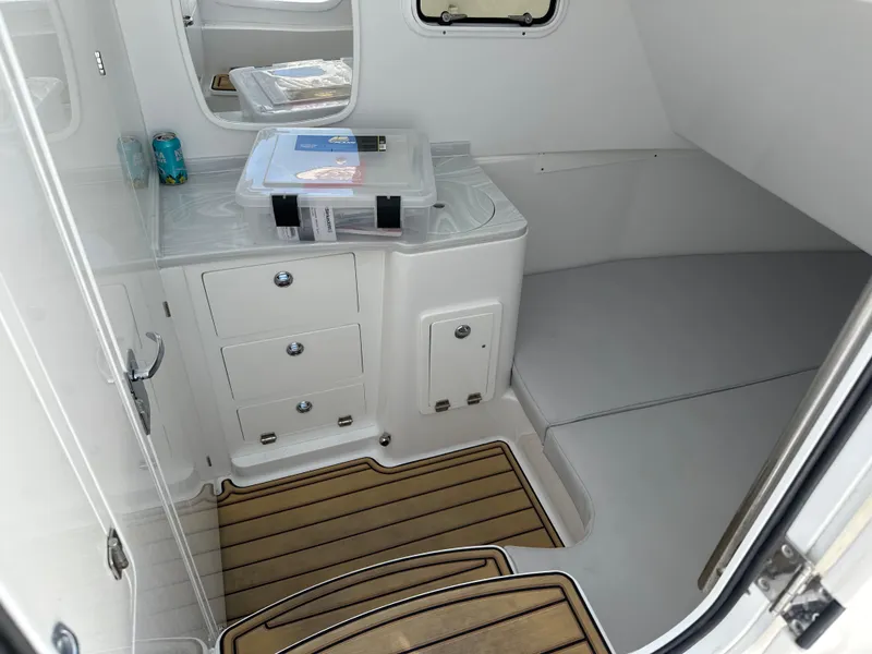 Slide: The Image of 2023 HCB 39 Speciale cabin interior with wooden flooring and storage compartments. - 10