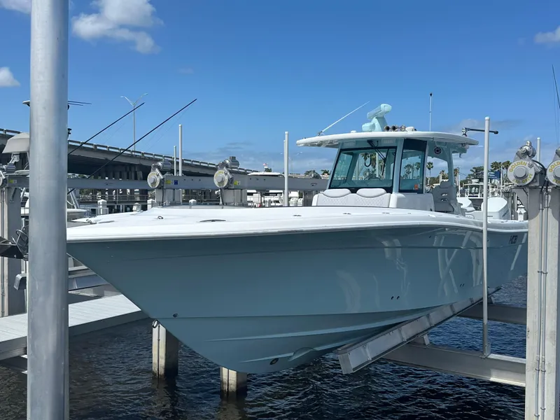 Slide: The Image of 2023 HCB 39 Speciale boat docked under a clear blue sky. - 17