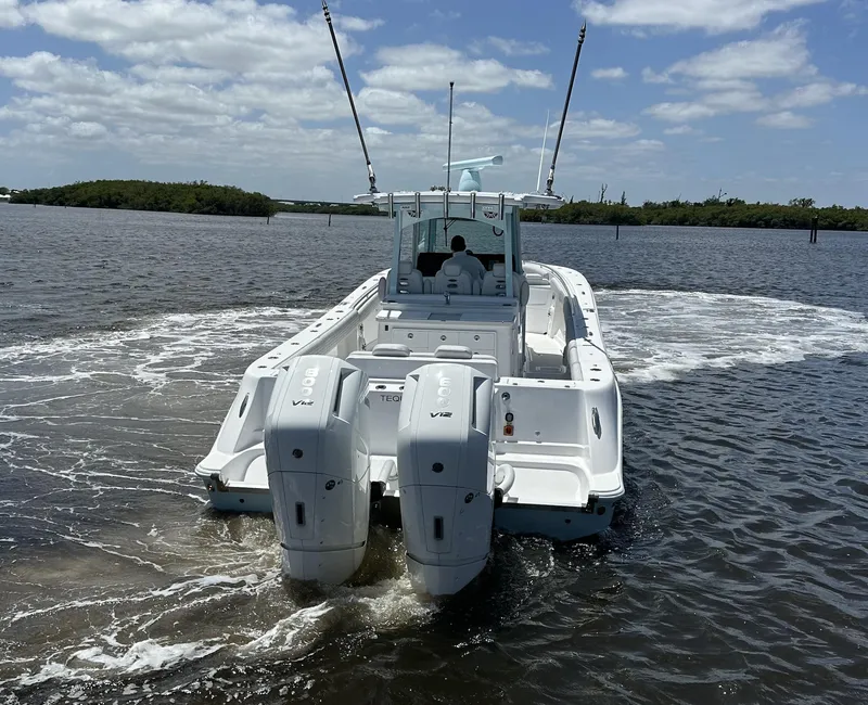 Slide: The Image of 2023 HCB 39 Speciale boat with dual engines cruising on a sunny day. - 19