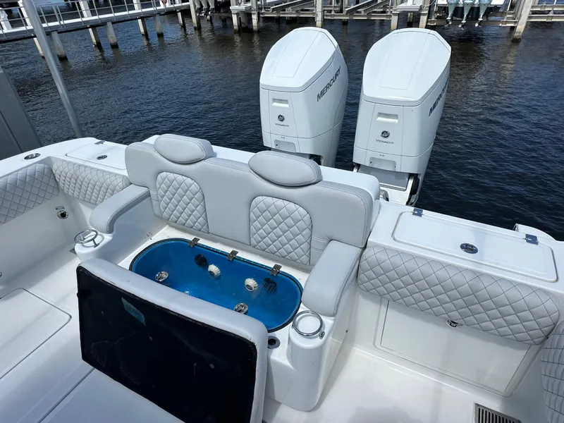 Slide: The Image of 2023 HCB 39 Speciale boat with luxurious seating and dual Mercury engines. - 2