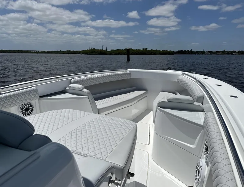 Slide: The Image of 2023 HCB 39 Speciale boat interior with luxurious seating on a sunny day. - 24