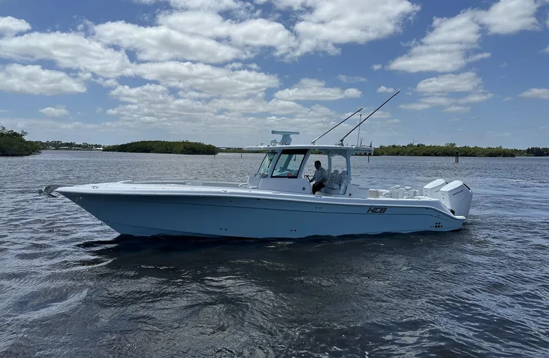 Slide: The Image of 2023 HCB 39 Speciale boat cruising on a sunny day with scattered clouds. - 25