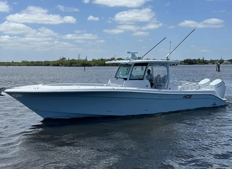 Slide: The Image of 2023 HCB 39 Speciale boat on water under a partly cloudy sky. - 26