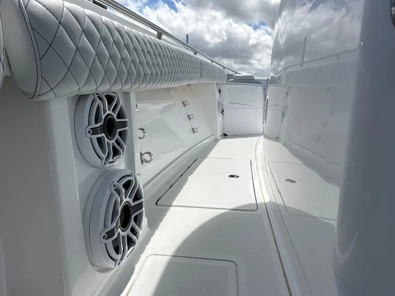 Slide: The Image of 2023 HCB 39 Speciale boat interior with quilted seating and built-in speakers. - 3