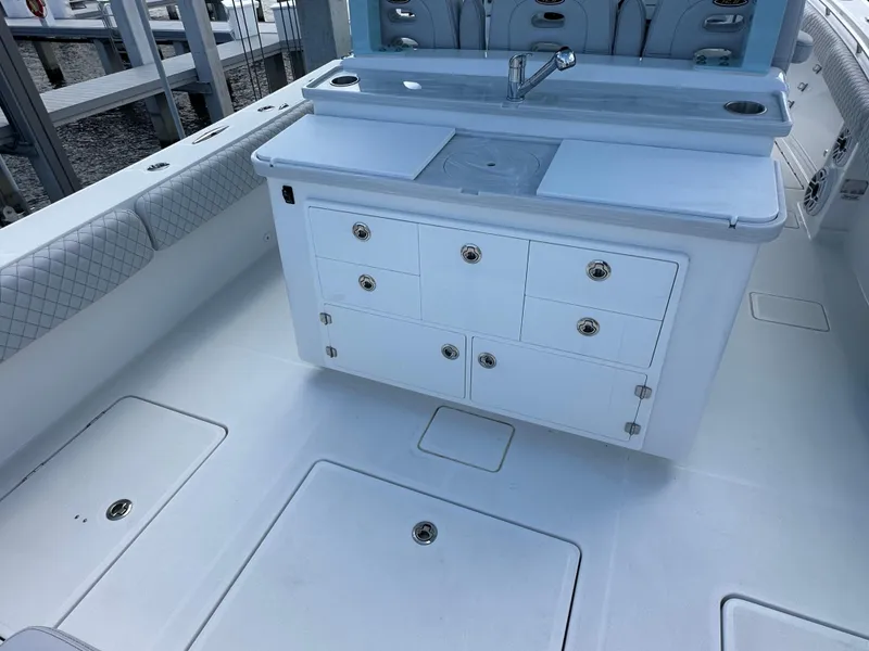 Slide: The Image of 2023 HCB 39 Speciale boat interior with storage cabinets and sink. - 4