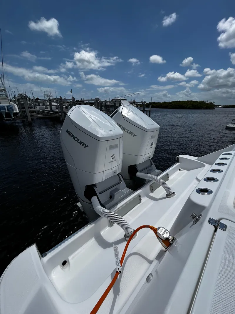 Slide: The Image of 2023 HCB 39 Speciale boat with dual Mercury outboard engines at a marina. - 7