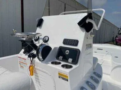 Slide: The Image of 2025 Blazer Bay 2220 Fisherman boat console with steering wheel and controls. - 7