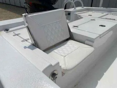 Slide: The Image of 2025 Blazer Bay 2220 Fisherman boat with white cushioned seating and storage compartments. - 9
