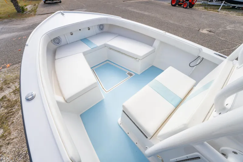 Slide: The Image of 2016 Albury Brothers 23 boat interior with white and blue seating arrangement. - 10
