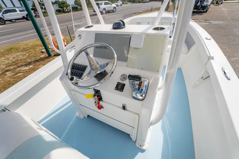 Slide: The Image of 2016 Albury Brothers 23 boat console with steering wheel and controls. - 11