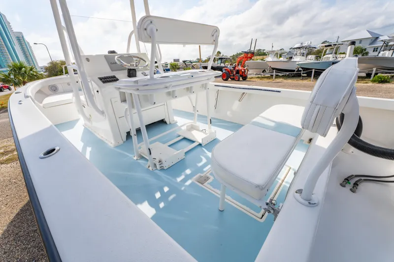 Slide: The Image of 2016 Albury Brothers 23 boat interior with white seating and steering console. - 13