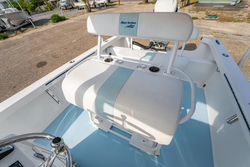 Slide: The Image of 2016 Albury Brothers 23 boat interior with white seating and blue accents. - 20