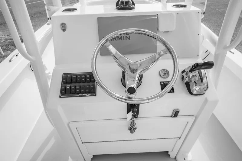 Slide: The Image of 2016 Albury Brothers 23 boat console with steering wheel and controls. - 21