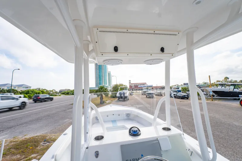Slide: The Image of 2016 Albury Brothers 23 boat on trailer, urban background, clear sky. - 22