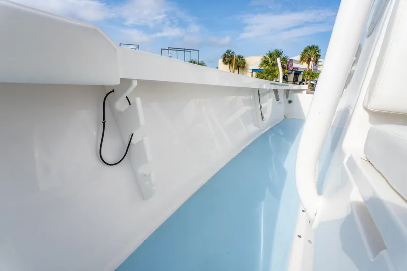 Slide: The Image of 2016 Albury Brothers 23 boat interior with sleek white and blue design. - 26